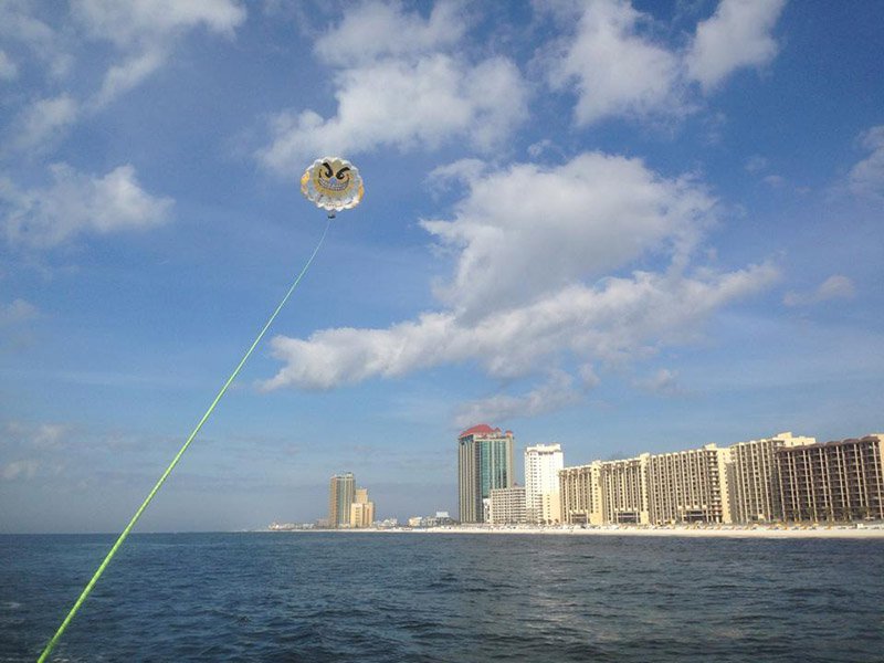 Soar above the Gulf on a parasail adventure.